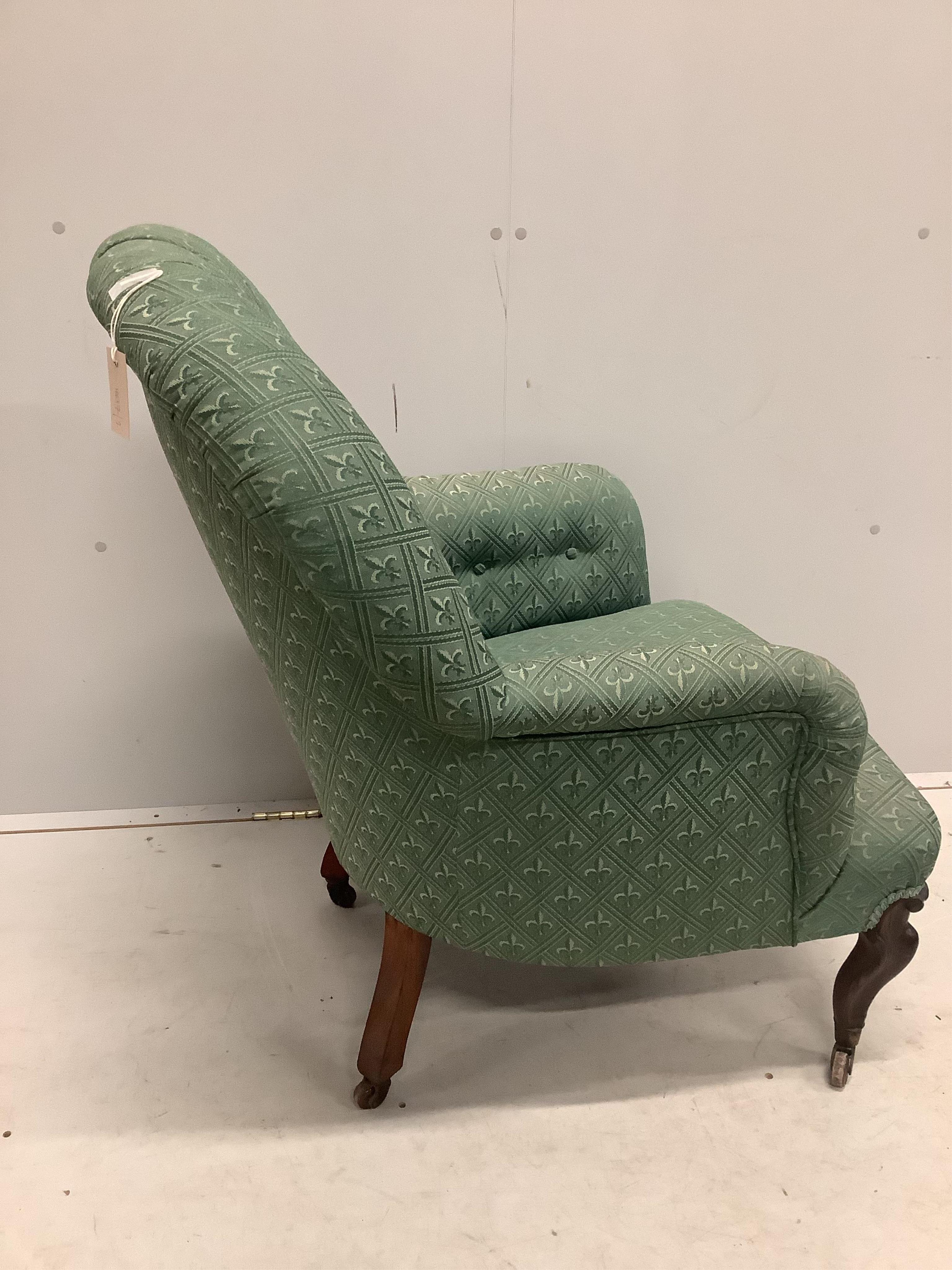 A Victorian rosewood spoonback armchair, width 68cm, depth 68cm, height 90cm. Condition - fair